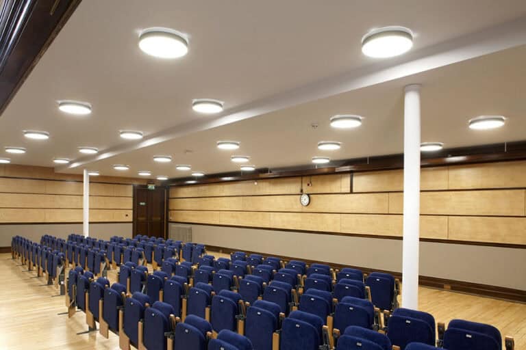 Bright interior lighting in The Victoria Rooms, Bristol auditorium.