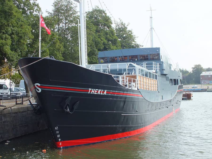 Electrical wiring and lighting installation on Thekla ship in Bristol harbor.