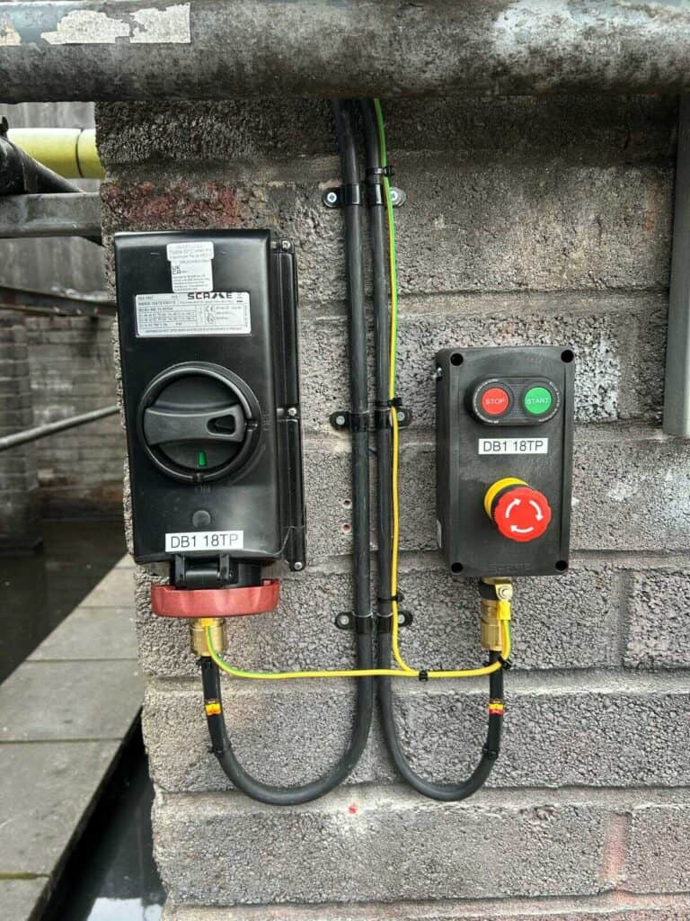 Electrical control panel with safety switches and wiring for home electrical system.