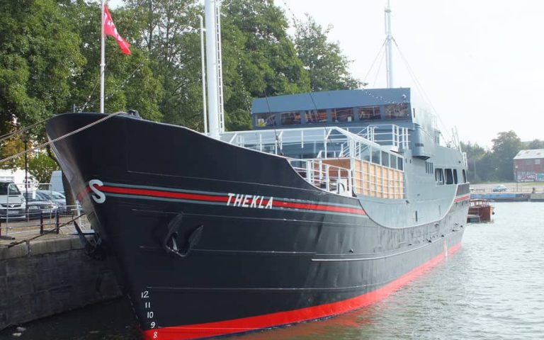 Electrical wiring and lighting installation on Thekla ship in Bristol harbor.